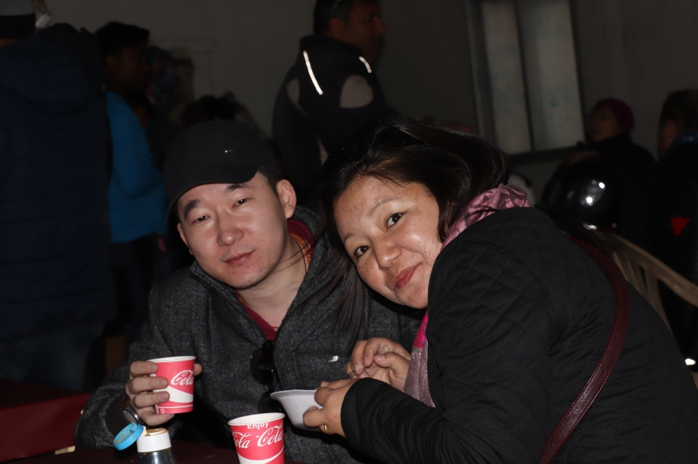 happy young couple at cafe, Leh,couple , Young, red, market, happy, winters, cafe, very cold