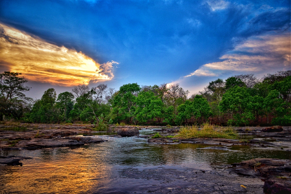Beautiful evening view of Munga Bahar River. Munga Bahar River, a tributary of Kanger River, forms this beautiful waterfall. Its height is about 300 feet, #nature #photography #love #instagood #photooftheday #travel #sky #beautiful #art #naturephotography #like #landscape #sunset #photo #picoftheday #instagram #sun #beach #life #winter #sea #fun #cute #clouds #happy #naturelovers #summer #bhfyp,  bastar, jagdalpur, Chhattisgarh, India, Raipur, Chhattisgarh, India, caves, Cave, kotamsarCave,