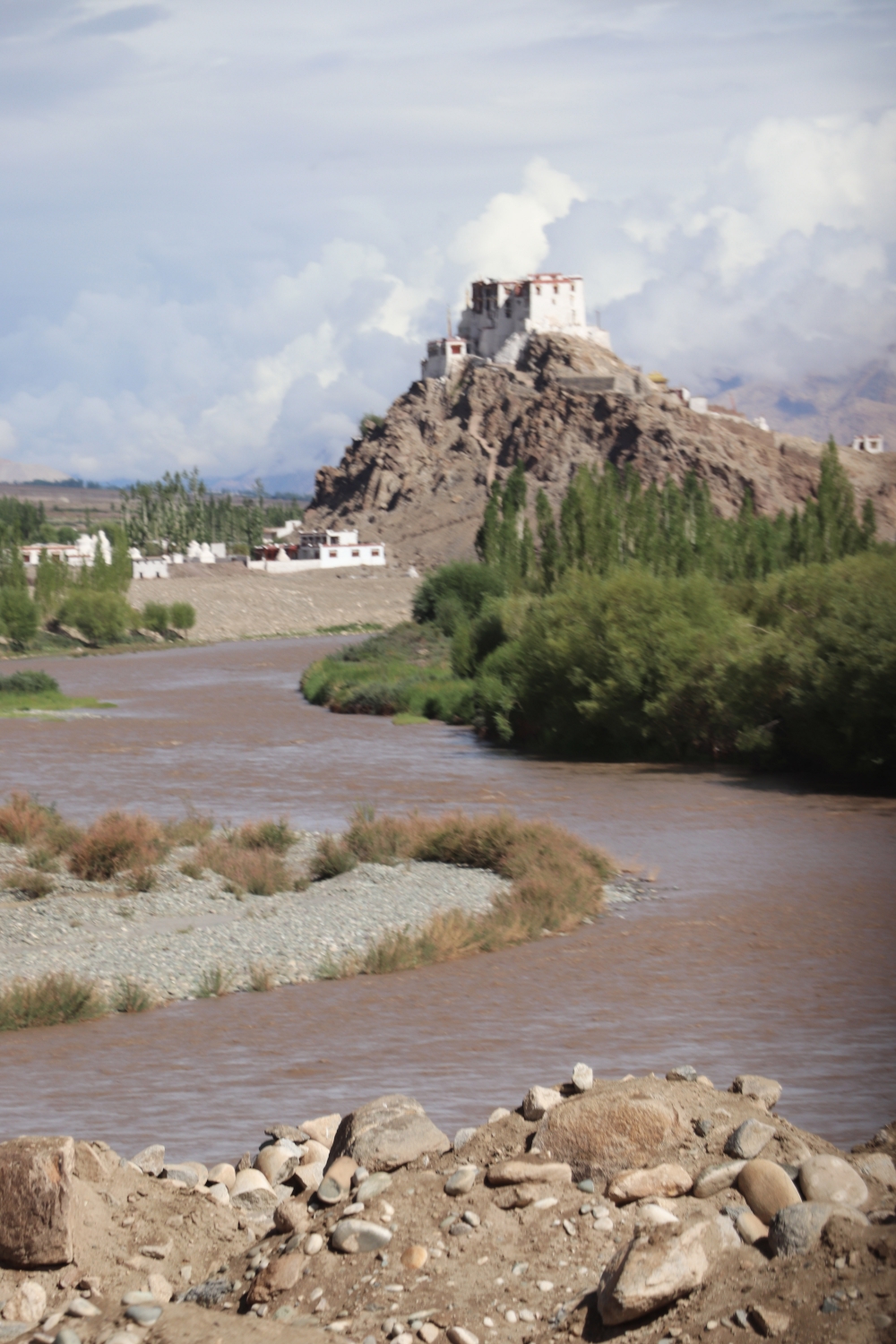 A monastery at a distance seen from riverbed, monastery, river, hills, distance, pictorial