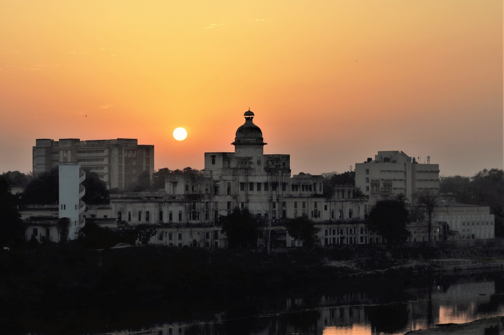 Setting sun over a heritage monument, Lucknow, Chattar Manzil, Sunset, Gomti River, colorful, 