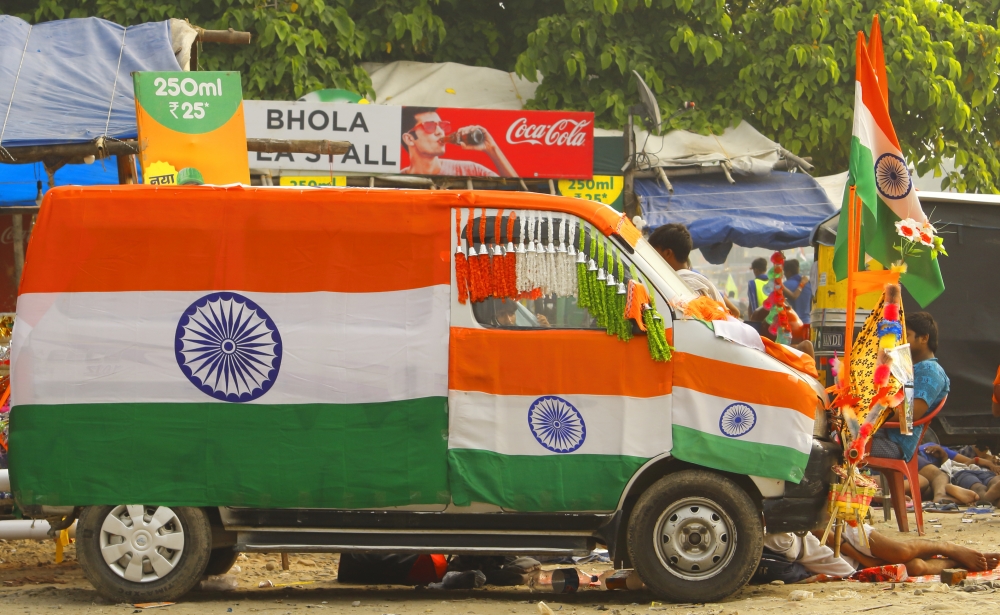 Car and Flag, notepad; copy; paper; table; country; unite; workplace; national; pen; nationalism; nationality; politics; liberty; pride; thinking; equipments; human; patriotic; flag; wood; government; freedom; digital; blank; device; space; planning; working; paperwork; ideas; hands; culture; indian; technology; wooden; unity; tablet; nation; patriotism; india; notebook; highlight; car; yellow; red; green; tyer; wheeel; shop; 