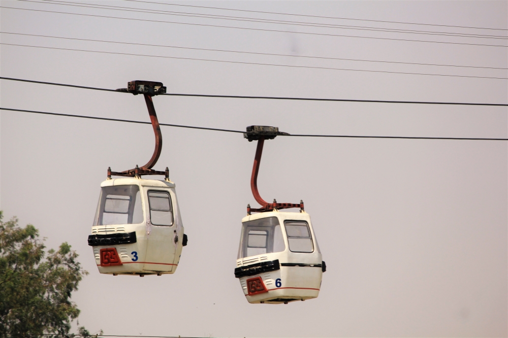 A pair of cable cars over Dhuvadhar water falls in India, Sky, cable cars, transport, river crossing 