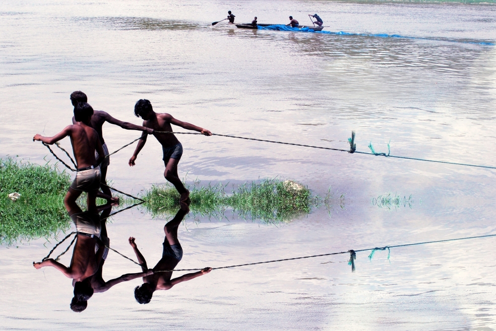 Coordination, riv er,silenc e,water,fish,fishermen,fishing net,coordination,cooperation,together,reflection